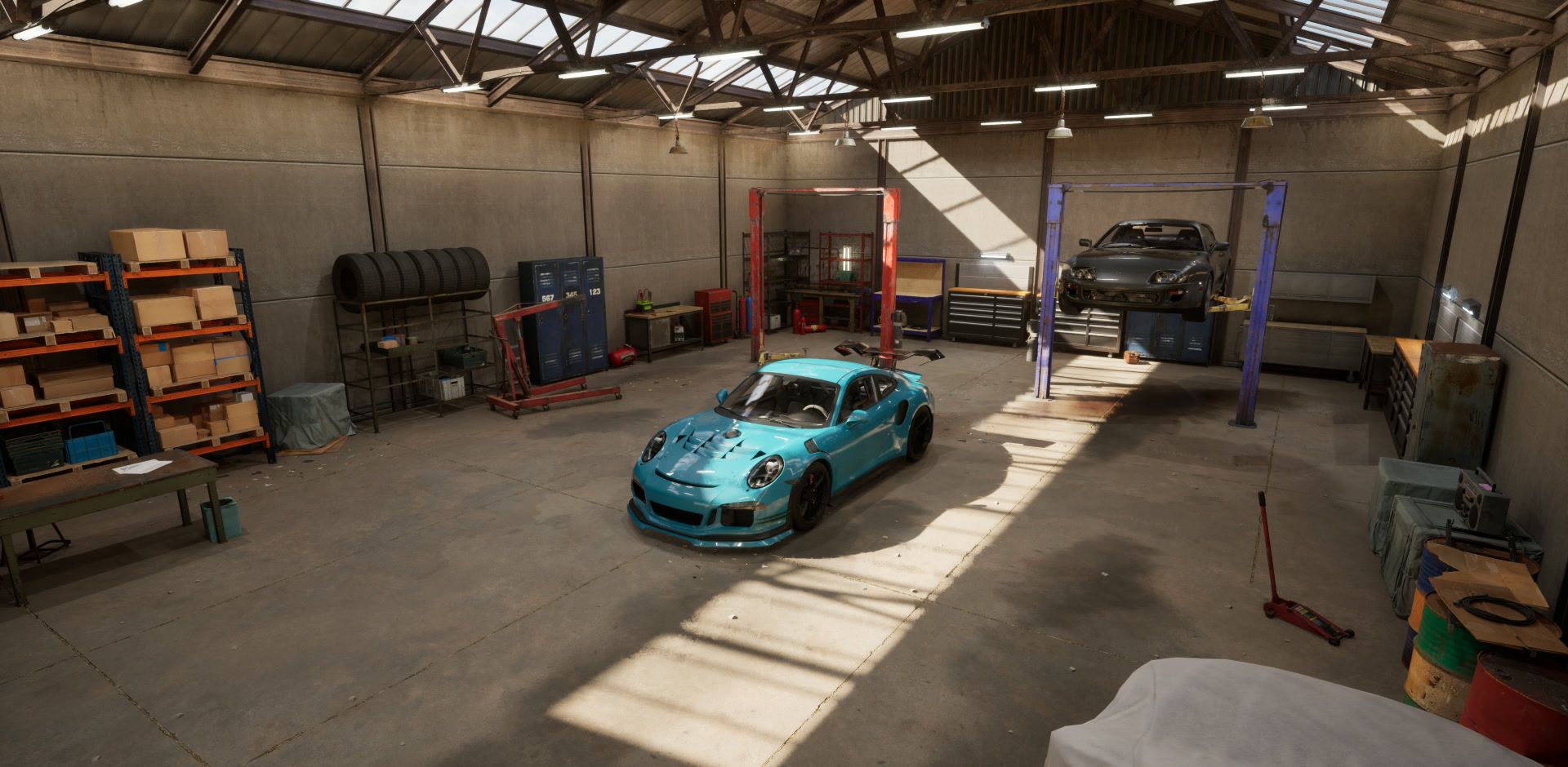 Garage from the entrance, teal car in a shaft of skylight