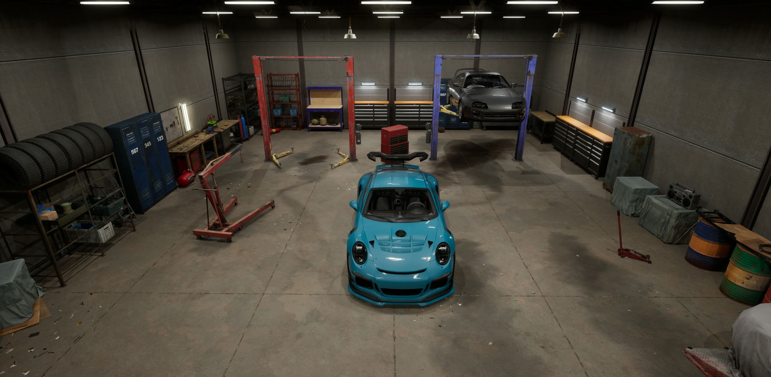 Garage overhead view with tool benches and tyre racks