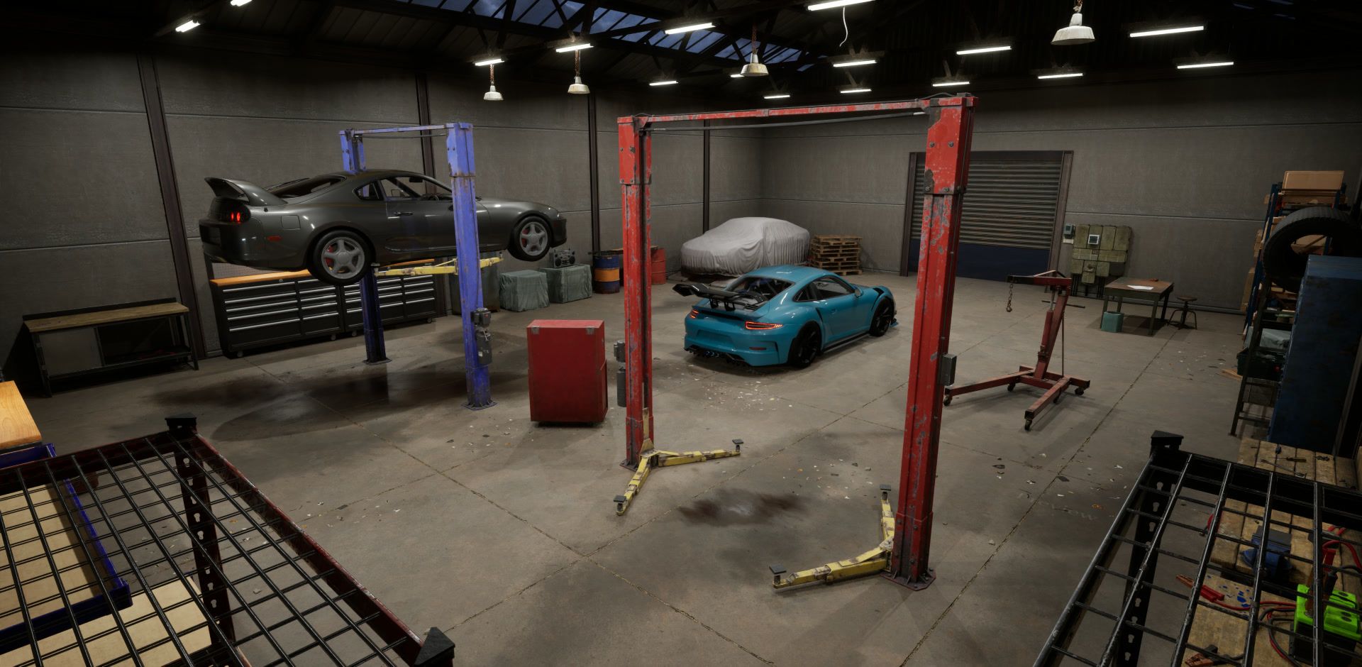 Garage from above: a car on a lift, the teal car parked nearby